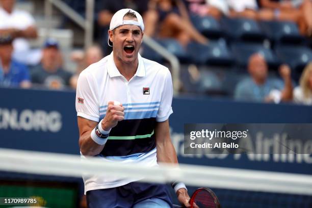 John Isner of the United States celebrates after winning his Men's Singles second round match against Jan-Lennard Struff of Germany on day four of...