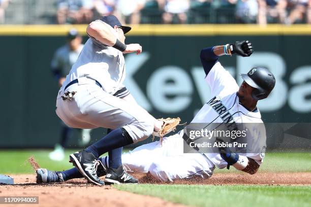 Keon Broxton of the Seattle Mariners is forced out trying to steal second base by DJ LeMahieu of the New York Yankees in the fourth inning during...