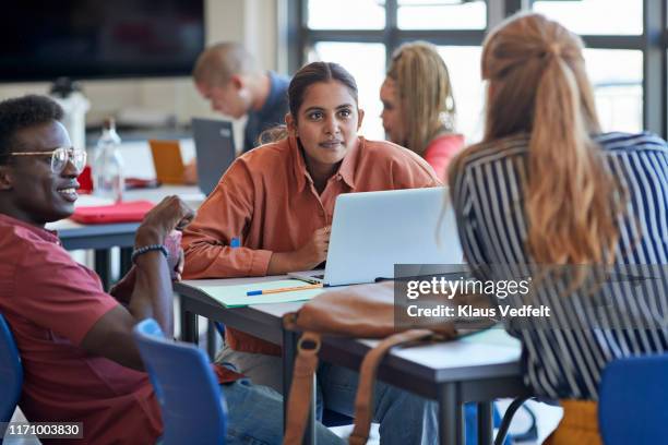 young man and woman looking at university student - fashion in an age of technology costume institute gala arrivals stockfoto's en -beelden