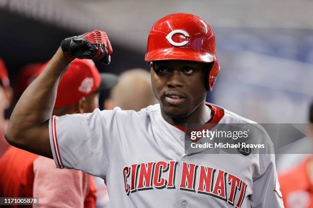 Aristides Aquino of the Cincinnati Reds celebrates after hitting a two-run home run against the Miami Marlins during the first inning at Marlins Park...