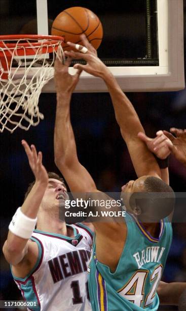 Memphis Grizzlies' Pau Gasol of Spain defends as New Orleans Hornets' P. J. Brown goes up for a shot during the first quarter, 06 January 2003, at...