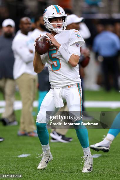 Jake Rudock of the Miami Dolphins warms up before an NFL preseason game against the New Orleans Saints at the Mercedes Benz Superdome on August 29,...