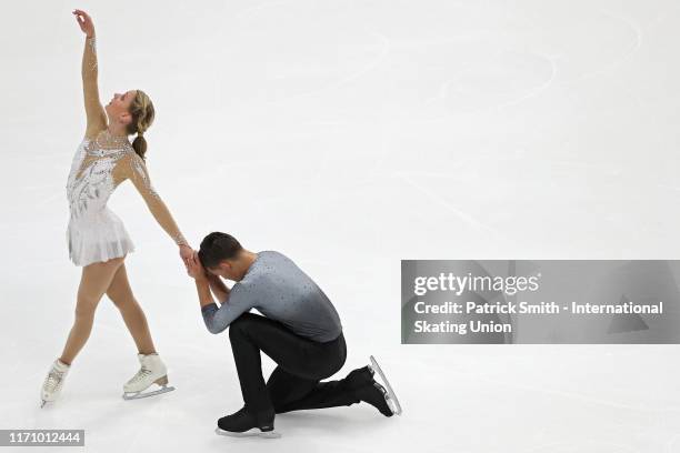 Kate Finster and Balazs Nagy of the United States perform in the Junior Pair Program during Day 1 of the ISU Junior Grand Prix of Figure Skating at...