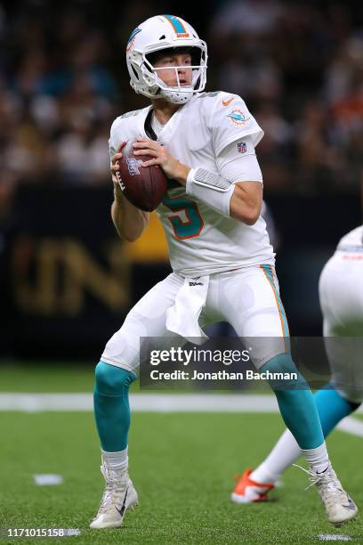 Jake Rudock of the Miami Dolphins looks to pass2 during the first half of an NFL preseason game against the New Orleans Saints at the Mercedes Benz...