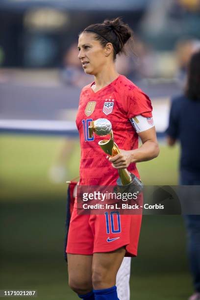 Carli Lloyd of United States of the U.S. Women's 2019 FIFA World Cup Championship team walks out with the FIFA World Cup trophy for the Victory Tour...