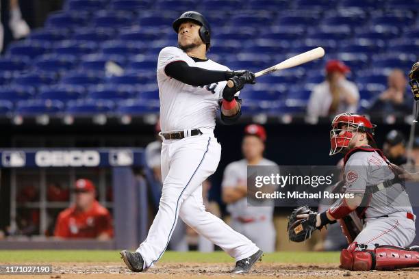 Harold Ramirez of the Miami Marlins hits a solo walk-off home run in the twelfth inning against the Cincinnati Reds at Marlins Park on August 29,...