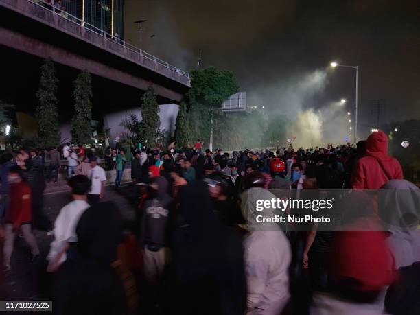 Thousands of students from junior high school clash with police during the protest to cancel anti corruption and code of law revision in front of...