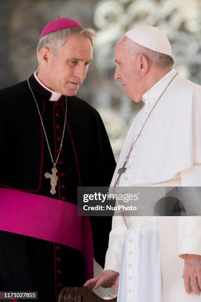 Pope Francis talks with Archibishop Georg Ganswein during his weekly general audience at the Saint Peters' square on September 25, 2019 in Vatican.