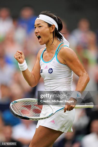 Kimiko Date-Krumm of Japan reacts to a play during her second round match against Venus Williams of the United States on Day Three of the Wimbledon...