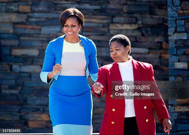First Lady Michelle Obama and Hector Pieterson's sister Antoinette Sithole at the Hector Pieterson memorial site on June 22, 2011 in Soweto,...