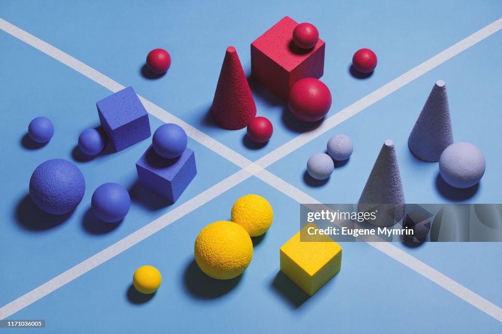 Abstract multi-colored objects on blue background