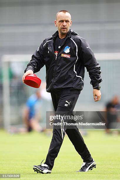 Head coach Holger Stanislawski of TSG 1899 Hoffenheim looks on during a training session at the Dietmar-Hopp Stadion on June 22, 2011 in Hoffenheim,...