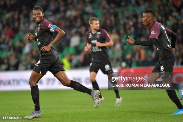 Metz's Senegalese forward Habib Diallo celebrates after scoring a goal with Metz's Malian midfielder Mamadou Fofana during the French L1 football...
