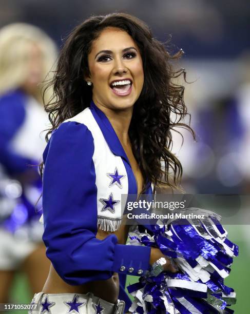 Dallas Cowboys Cheerleader performs during a NFL preseason game at AT&T Stadium on August 29, 2019 in Arlington, Texas.