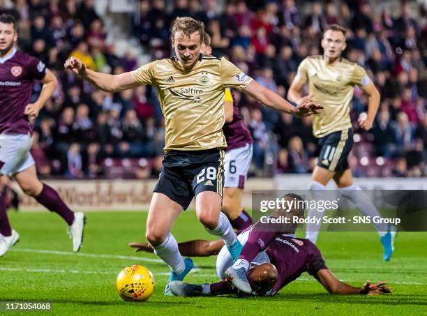 Aberdeens James Wilson is brought down by Loic Damour as Aberdeen are awarded a penalty during the Betfred Cup Quarter-Final match between Heart of...