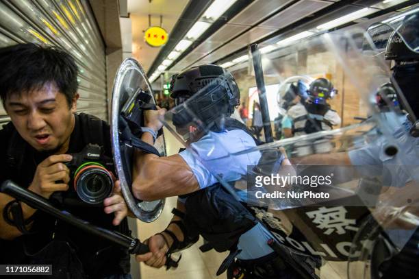 Police officer is seen pushing a Photographer with his shield in Sha Tin in Hong Kong on September 25 Pro- Democracy Protester Have Been Protesting...
