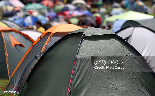 Rain drops on tents are caught by sunlight at the Glastonbury Festival site at Worthy Farm, Pilton on June 22, 2011 in Glastonbury, England. Heavy...