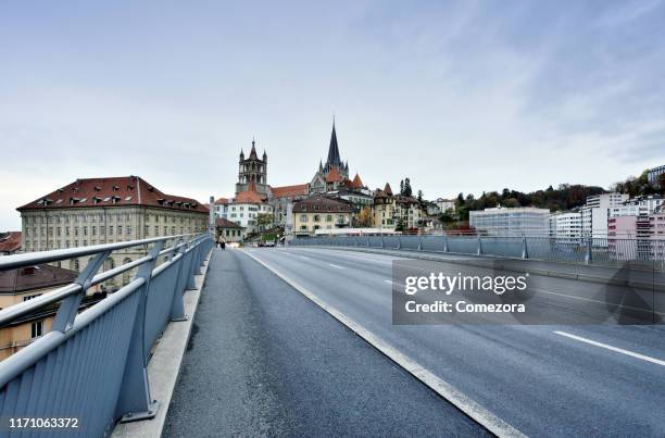 lausanne cityscape and cathedral of notre dame at sunset, switzerland - lausanne stock-fotos und bilder