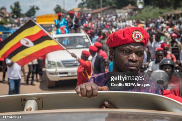 Bobi Wine and "people power" opposition supporter takes part during the rally in Hoima, Wine aka Robert Kyagulanyi, campaigned in Hoima ahead of a...