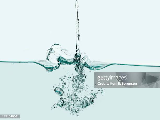 water surface with bubbles - pouring stock pictures, royalty-free photos & images