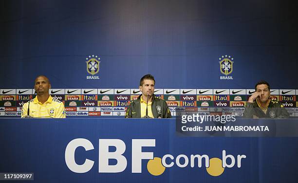 Brazil's goalkeepers Jefferson, Victor and Julio Cesar attend a press conference after a training session near Campana, some 60 Km from Buenos Aires...