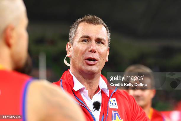 Wayne Carey head coach of the All-Stars gives instructions during the EJ Whitten Legends Match at AAMI Park on August 30, 2019 in Melbourne,...
