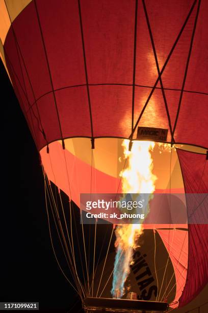 fire of air hot balloon at cappadocia turkey - hot air ballon foto e immagini stock