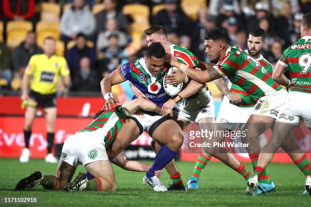 Ken Maumalo of the Warriors is tackled during the round 24 NRL match between the New Zealand Warriors and the South Sydney Rabbitohs at Mt Smart...