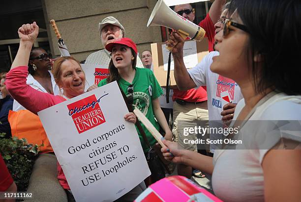 Chicago school teachers demonstrate June 22, 2011 in Chicago, Illinois. Hundreds of teachers joined in the protest outside the offices of the Chicago...