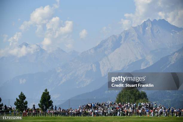 Spectators watch on the driving range during Day Two of the Omega European Masters at Crans-sur-Sierre Golf Club on August 30, 2019 in Crans-Montana,...