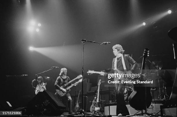 British rock band Wings on stage at the Hammersmith Odeon during their 'Wings Over the World tour', London, UK, 18th October 1976.