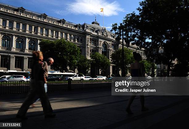 Pedestrians stroll past the national central Bank of Spain on June 22, 2011 in Madrid, Spain. Eurozone finance ministers are currently seeking to...