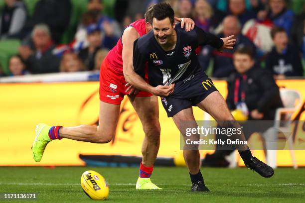 Jimmy Bartel of Victoria is tackled by Matthew Richardson of the All-Stars during the EJ Whitten Legends Match at AAMI Park on August 30, 2019 in...