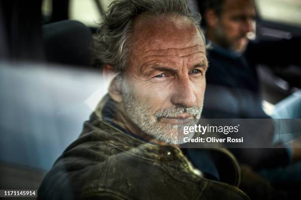 portait of man with grey hair in a car - car reflection stock pictures, royalty-free photos & images