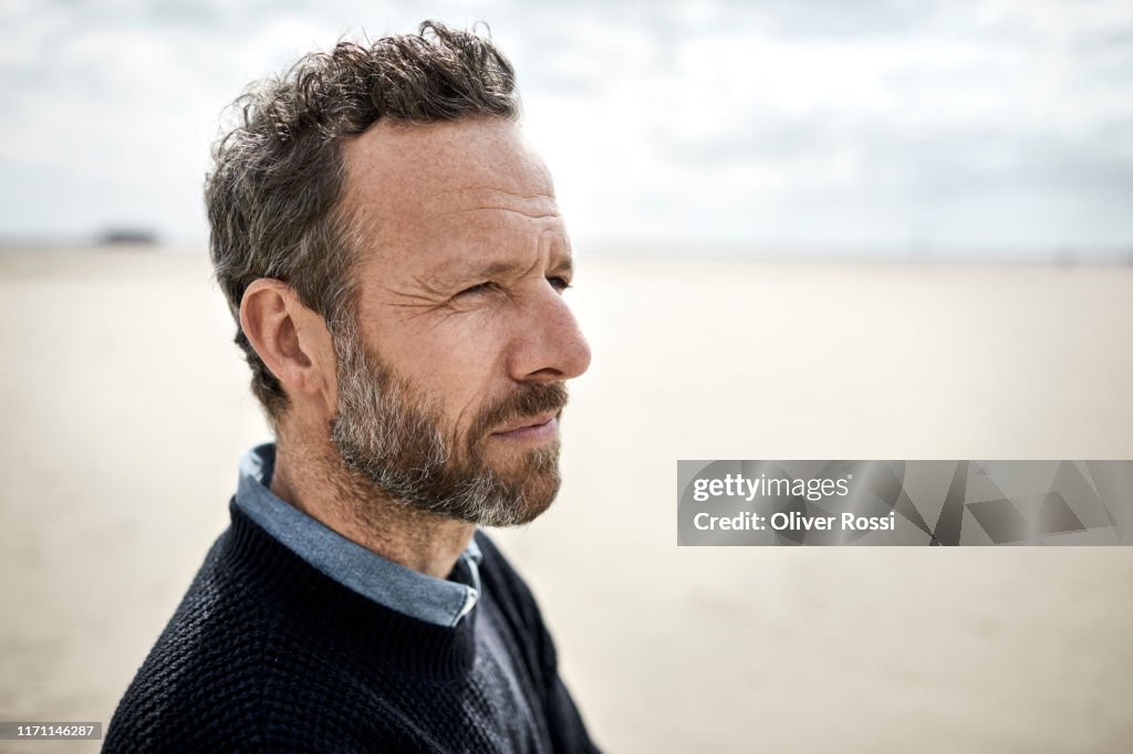 Portrait of pensive bearded man on the beach