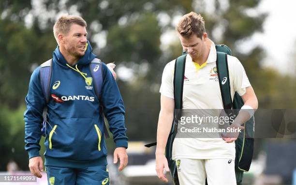 David Warner talks to Steve Smith of Australia after a net session during the Tour Match between Derbyshire and Australia at The County Ground on...