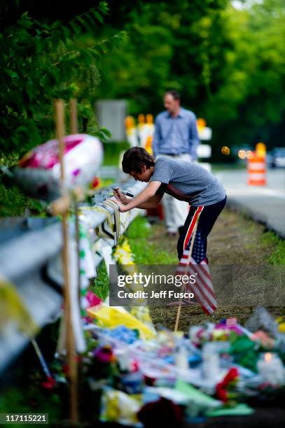 Mourners pay tribute at the fatal crash scene where'Jackass' star Ryan Dunn and passenger Zachary Hartwell were killed after Dunns car left the...