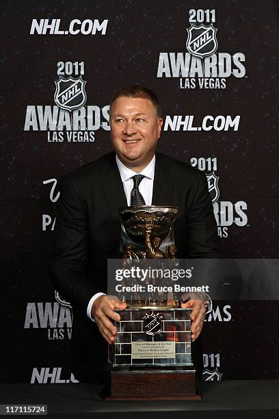 General Manager Mike Gillis of the Vancouver Canucks poses after winning the NHL General Manager of the Year Award during the 2011 NHL Awards at The...