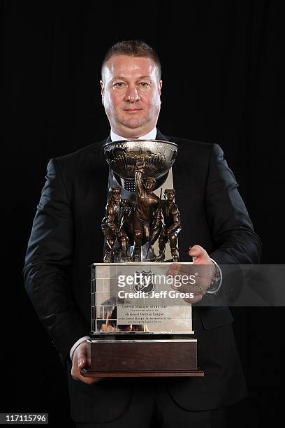 General Manager Mike Gillis of the Vancouver Canucks poses after winning the NHL General Manager of the Year Award during the 2011 NHL Awards at The...
