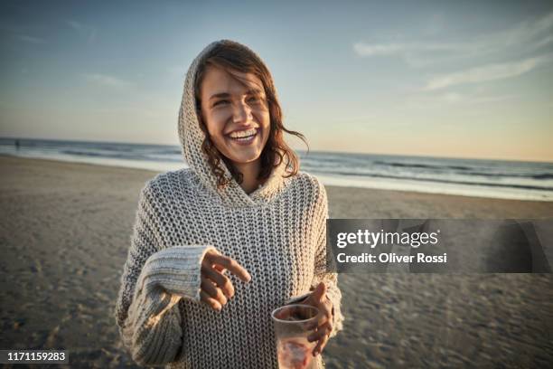 portrait of happy woman on the beach at sunset - região marítima do norte da alemanha imagens e fotografias de stock