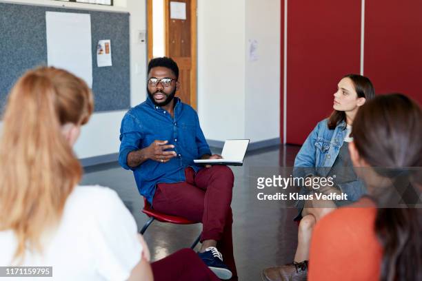 mental health professional advising to students - mental health professional stock photos et images de collection