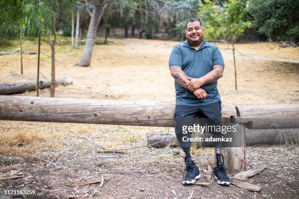 full body of hispanic male amputee - fat mexican man stock pictures, royalty-free photos & images