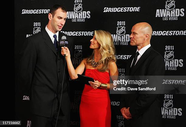 Network reporter Michelle Beisner interviews Zdeno Chara of the Boston Bruins as former NHL player Mark Messier looks on during the 2011 NHL Awards...