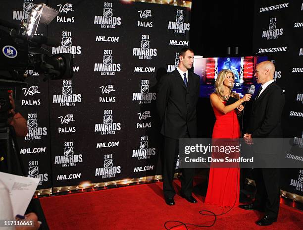 Network reporter Michelle Beisner interviews former NHL player Mark Messier as Zdeno Chara of the Boston Bruins looks on during the 2011 NHL Awards...