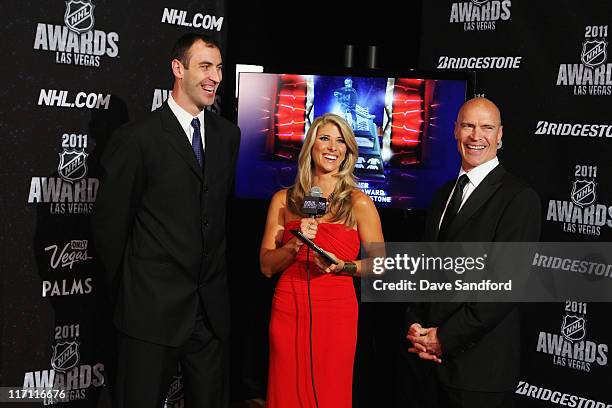 Zdeno Chara of the Boston Bruins, NHL Network reporter Michelle Beisner and former NHL player Mark Messier have a laugh during the 2011 NHL Awards at...