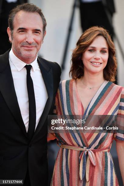 Jean Dujardin and Nathalie Pechalat walksthe red carpet ahead of the "J'Accuse" screening during the 76th Venice Film Festival at Sala Grande on...