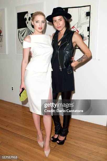 Actress Amber Heard and artist Tasya Van Ree attends Tasya Van Ree's private viewing of "Distorted Delicacies" at Vs. Magazine & Creative Studios...