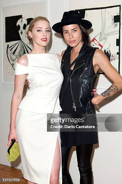 Actress Amber Heard and artist Tasya Van Ree attends Tasya Van Ree's private viewing of "Distorted Delicacies" at Vs. Magazine & Creative Studios...