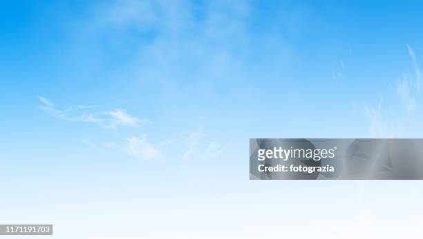 blue sky background - clear sky stock-fotos und bilder