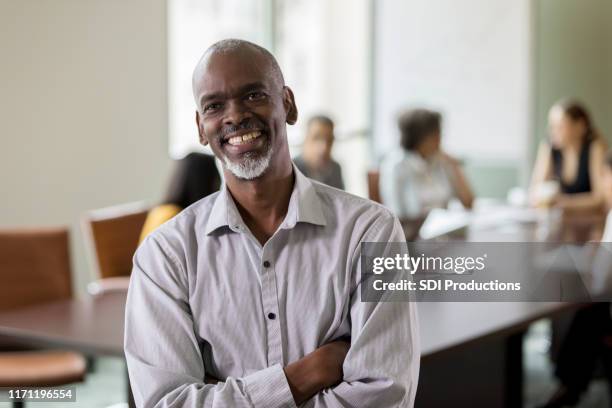 confident mature businessman - governing board stock pictures, royalty-free photos & images